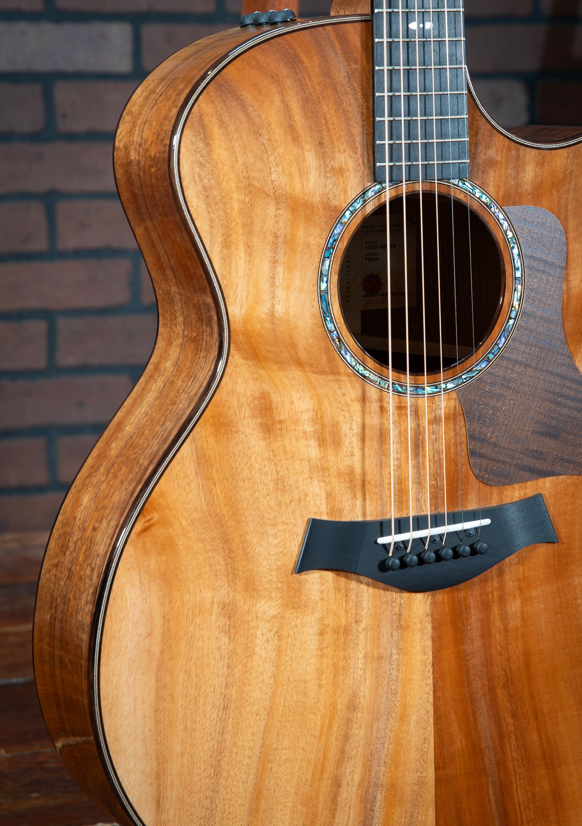 Acoustic Taylor 724ce Hawaiian Koa guitar with rosewood binding and ES2 pickup