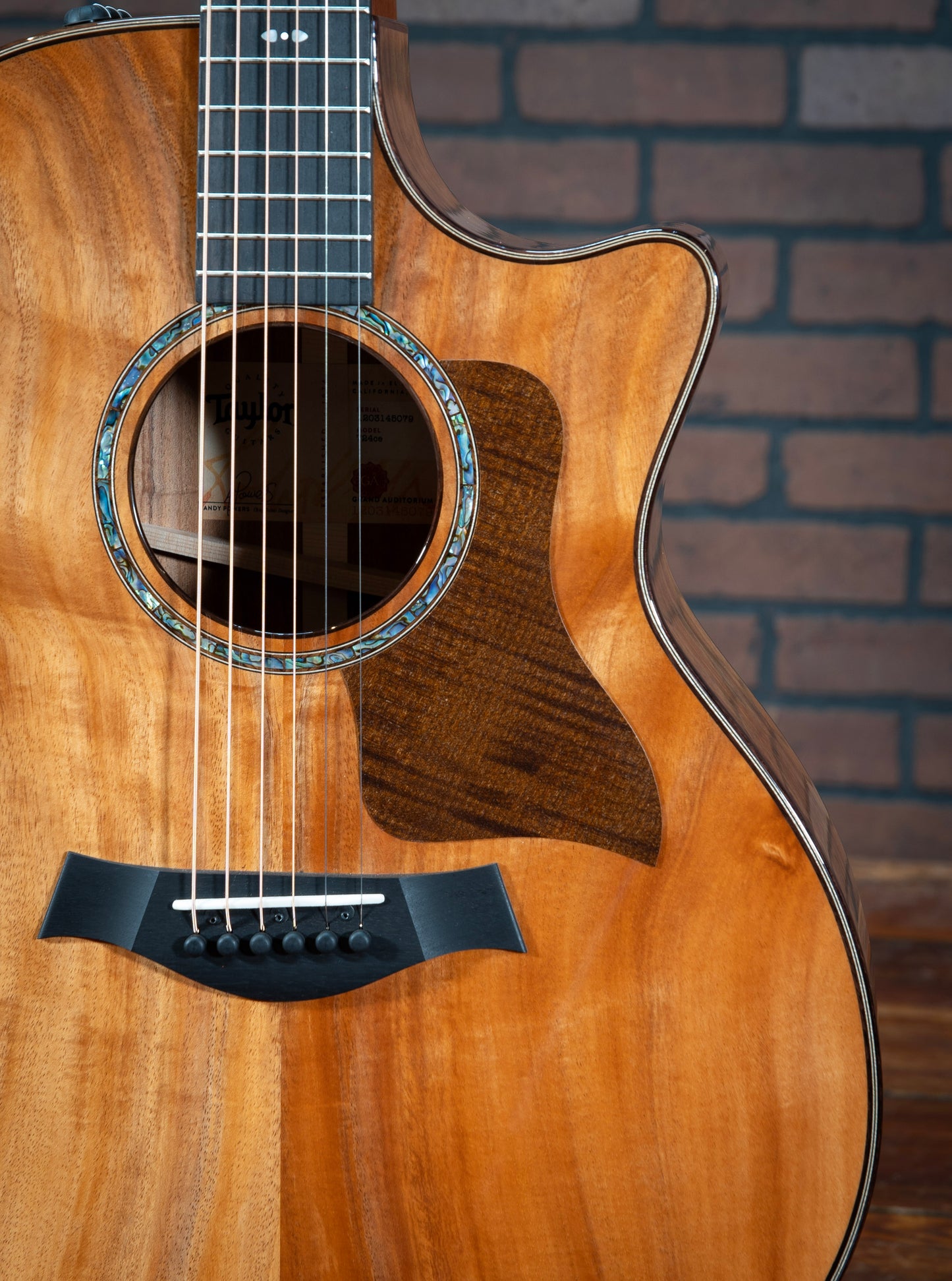Acoustic Taylor 724ce Hawaiian Koa Guitar with paua shell rosette and dark-stained sycamore pickguard